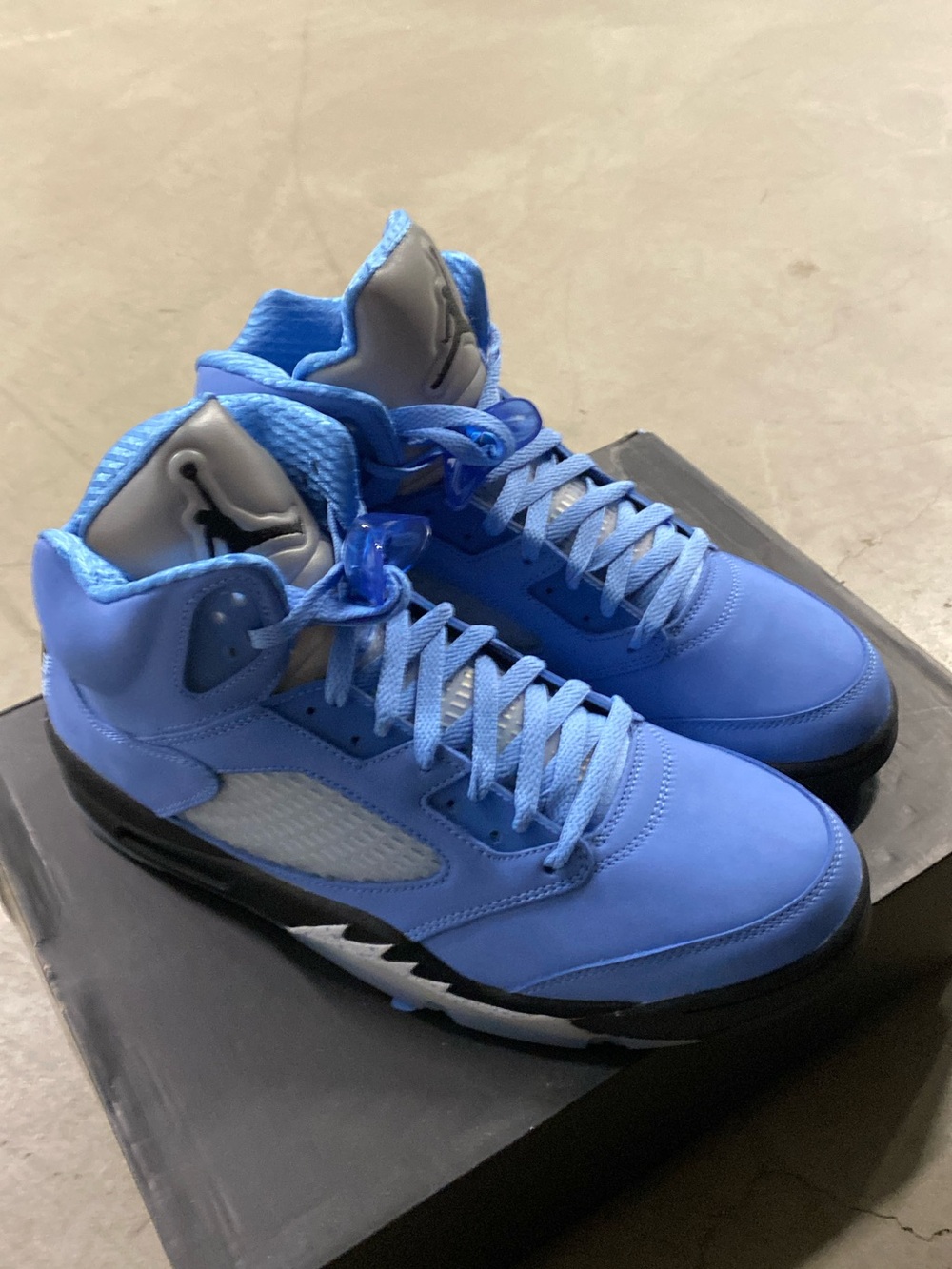 Jordan Retro High-Top Sneakers in University Blue and Black